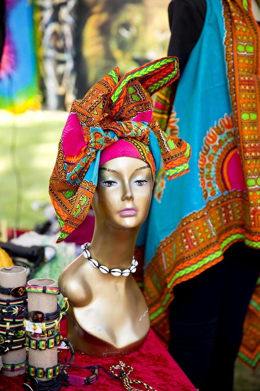 Jazz musicians performing on outdoor festival stage with colorful lights